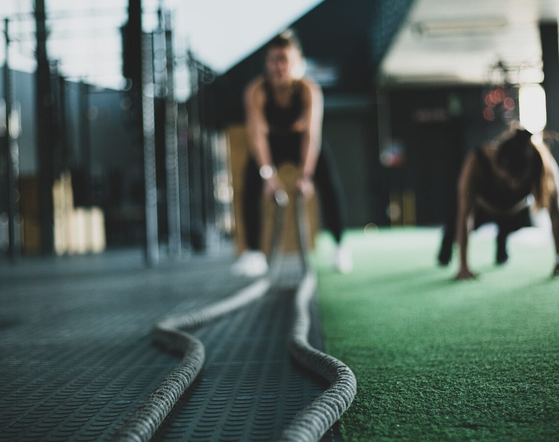 two person inside gym exercising